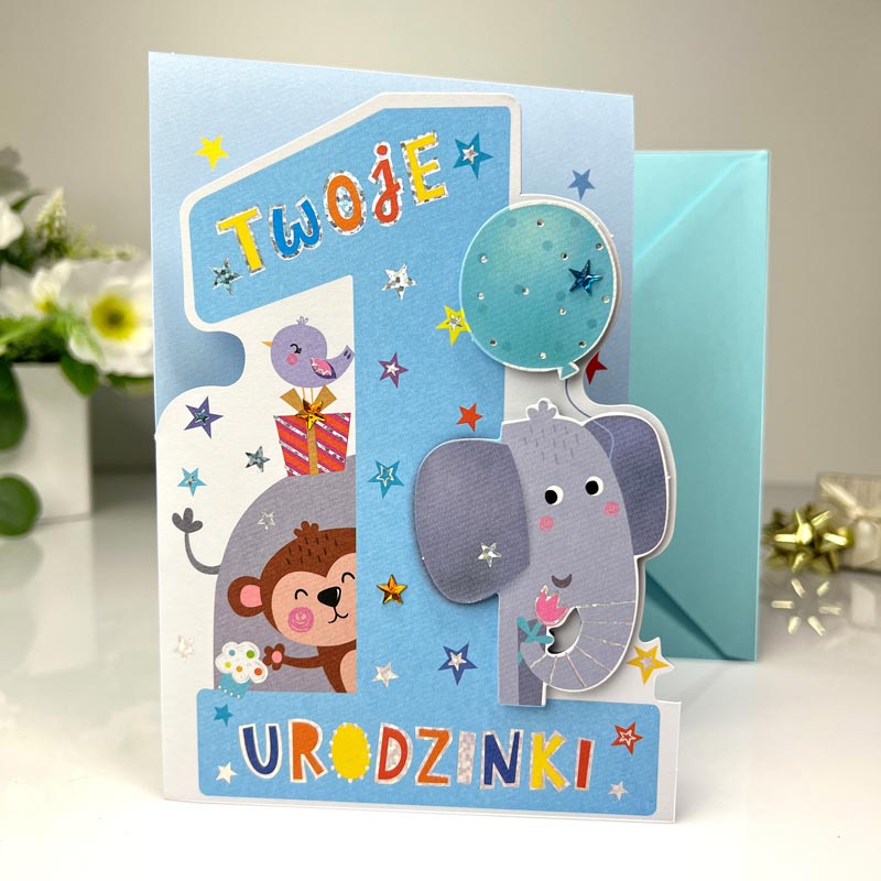 Kartka urodzinowa Roczek Dziecka słonik. Kartka w kolorze niebieski z cyfrą 1 z efektem 3D w otoczeniu słonika i małpki.